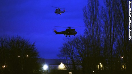 Helicopters fly over buildings in Dammartin-en-Goele, France, where there was a standoff Friday, January 9, between police and two men suspected in the Charlie Hebdo shootings earlier this week. Cherif and Said Kouachi, the two brothers wanted in the case, were killed by security forces, a local mayor said.