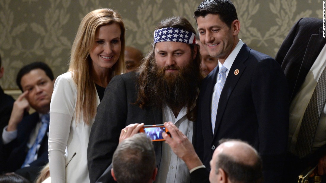 Willie Robertson of the reality TV series &quot;Duck Dynasty&quot; poses for a picture with Ryan and his wife, Janna, before President Obama delivers his State of the Union address on January 28, 2014.