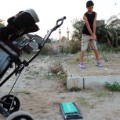 Boy playing golf in Benghazi, Libya