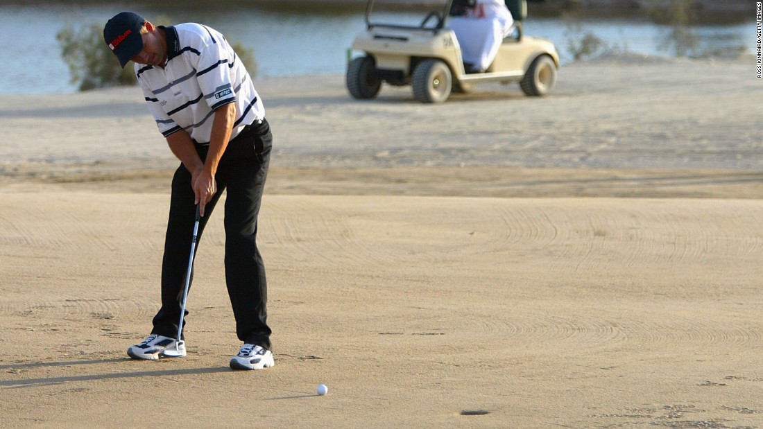 Padraig Harrington of Ireland putts on the 17th hole during the Abu Dhabi World Sand Golf Championships at Al Ghazal in 2004.