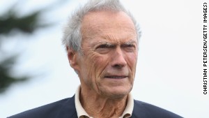 PEBBLE BEACH, CA - FEBRUARY 09: Clint Eastwood stands on the 18th green during the final round of the AT&T Pebble Beach National Pro-Am at the Pebble Beach Golf Links on February 9, 2014 in Pebble Beach, California. (Photo by Christian Petersen/Getty Images)