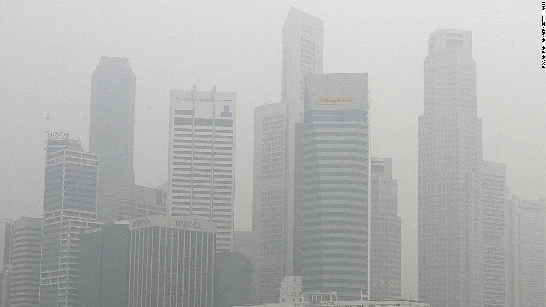 The haze problem has been ongoing for many years -- this 2006 image shows Singapore&#39;s skyscrapers enveloped in smog. Experts have warned that the annual recurrence of carbon-rich haze caused by fires in Indonesia could fuel global warming if not stopped.