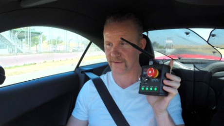 Morgan Spurlock gets ready to ride in a self-driving race car.