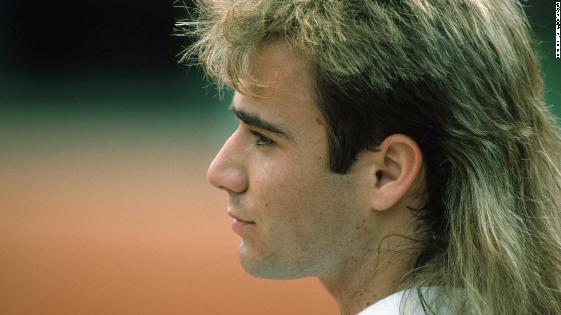 Andre Agassi is pictured during his breakthrough year in 1988, when he reached the semifinals of the French Open and the U.S. Open, sporting highlights and a mullet. 