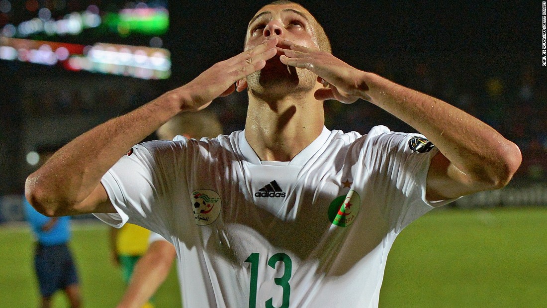 Title favorite Algeria defeats South Africa 3-1 in its first Group C game. Striker Islam Slimani celebrates scoring the third goal. Algeria reached the knockout stages of the 2014 World Cup.