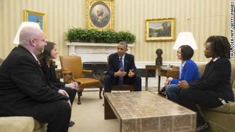 US President Barack Obama speaks with people who wrote him personal letters throughout the year, and who will attend tonight's State of the Union address, in the Oval Office of the White House in Washington, DC, January 20, 2015. Seated alongside Obama are: Victor Fugate (L) of Kansas City, Missouri; Rebekah Erler of Minneapolis, Minnesota (2nd L), Carolyn Reed (2nd R) of Denver, Colorado; and Katrice Mubiru (R), Woodland Hills, California.