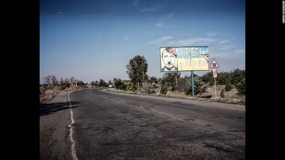 A billboard with a picture of Russian President Vladimir Putin as Hitler and the words &quot;Get out from Ukraine,&quot; is seen on the road from Mykolaiv to Kherson in July 2014.