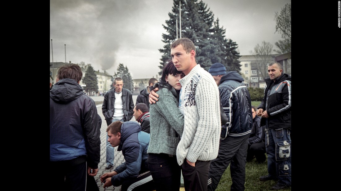 A couple stand with a pro-separatist &quot;civil self-defense&quot; group of locals. They were unarmed and kept vigil by the administrative building in Yenakiieve, the birthplace of ousted President Viktor Yanukovych.&lt;br /&gt;