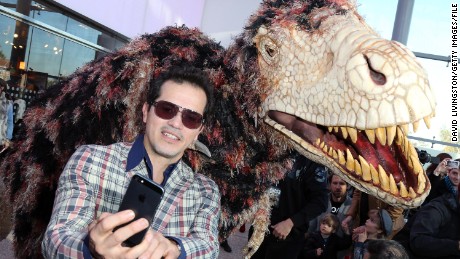 Actor John Leguizamo shoots a selfie at the &quot;Walking with Dinosaurs&quot; press event at the Los Angeles Natural History Museum.