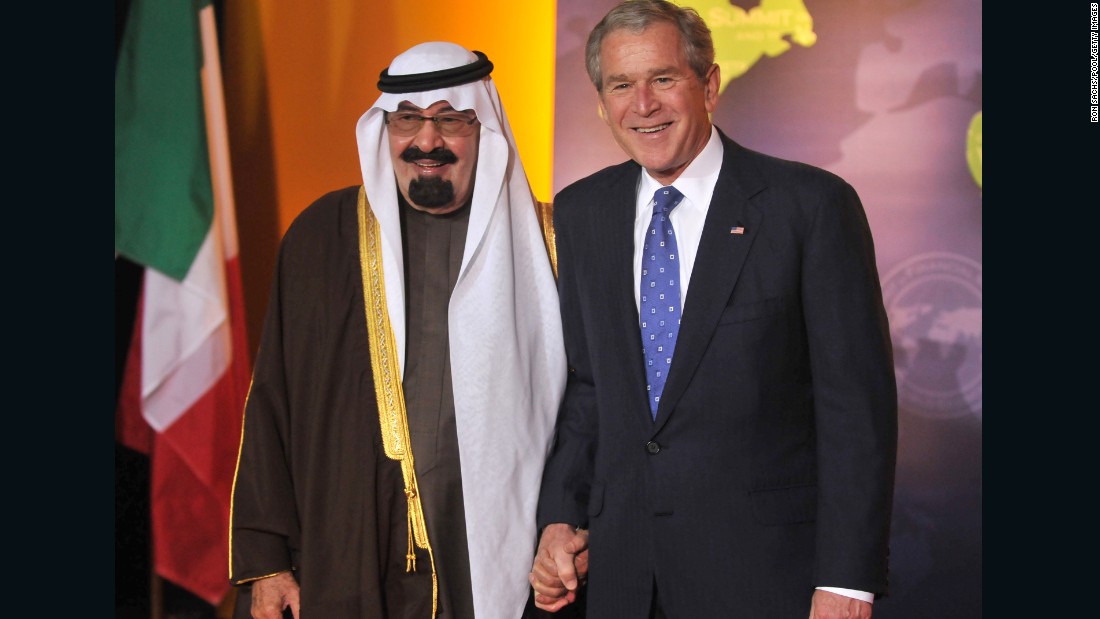 The King poses with U.S. President George W. Bush during an economic summit in Washington in November 2008.