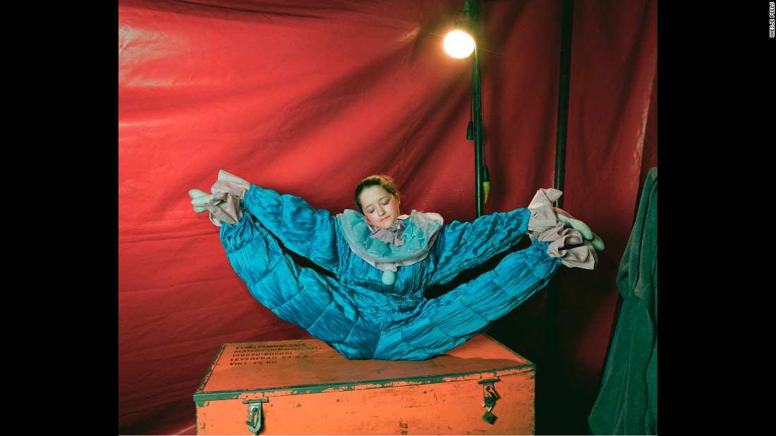 A clown from a traveling circus stretches backstage in Belgium. Dutch photographer Wiesje Peels has followed several circuses in Europe. The photos in her book &quot;Mimus&quot; capture a glimpse of the performers&#39; &quot;hidden life.&quot;