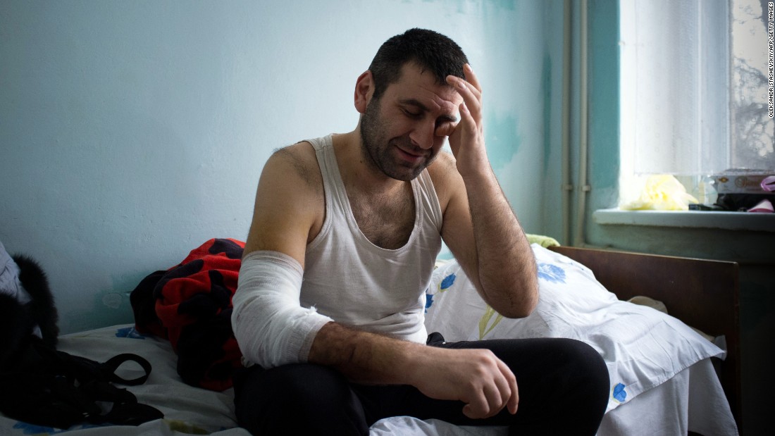 A man injured during shelling in Mariupol sits in an emergency hospital on January 26.