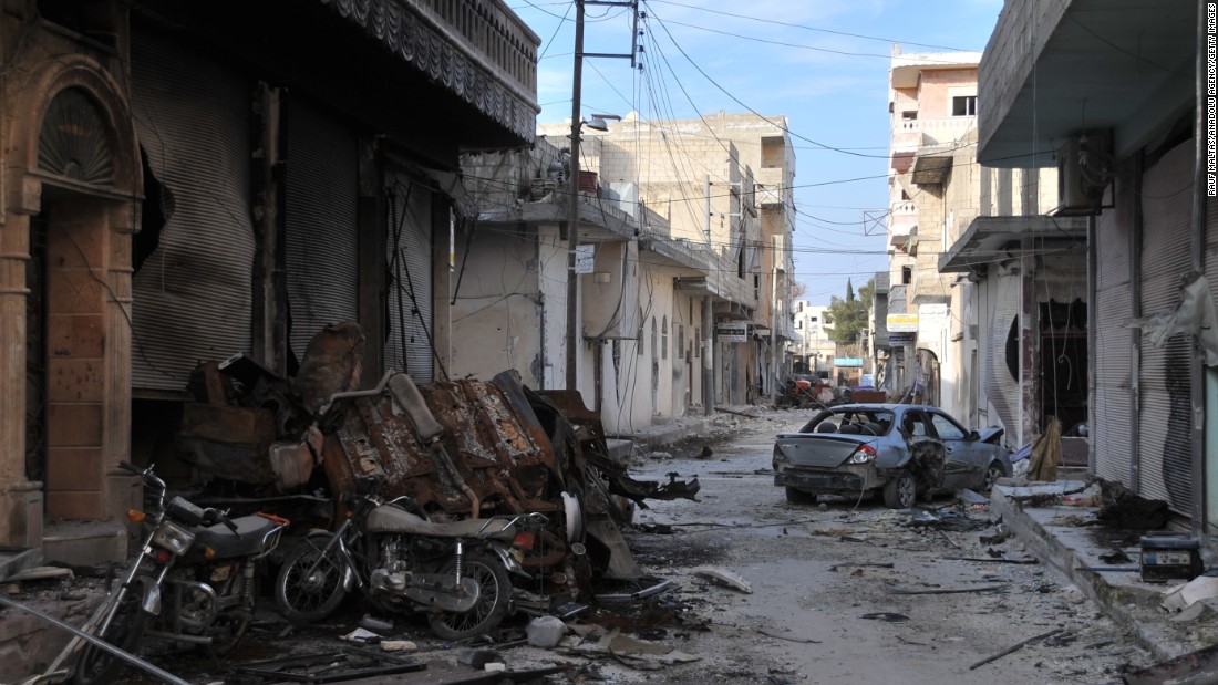 Collapsed buildings are seen in Kobani on January 27 after Kurdish forces took control of the town from ISIS.