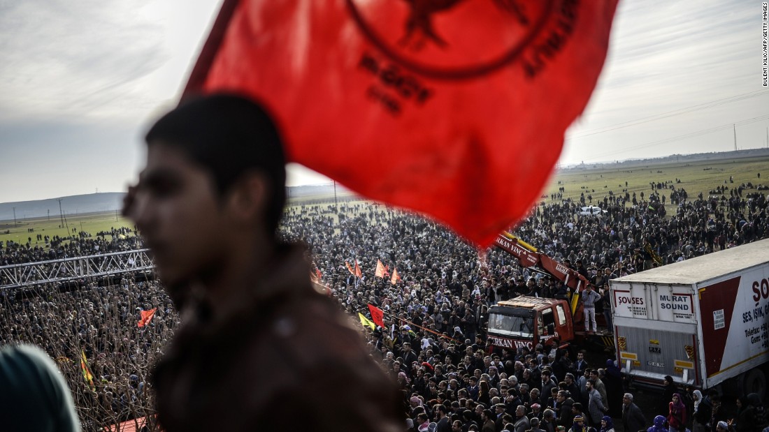 Kurdish people celebrate in Suruc, Turkey, near the Turkish-Syrian border, after ISIS militants were expelled from Kobani on Tuesday, January 27.