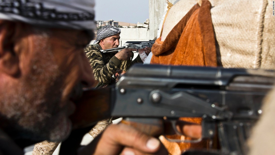 Fighters from the Free Syrian Army and the Kurdish People&#39;s Protection Units join forces to fight ISIS in Kobani on Wednesday, November 19.