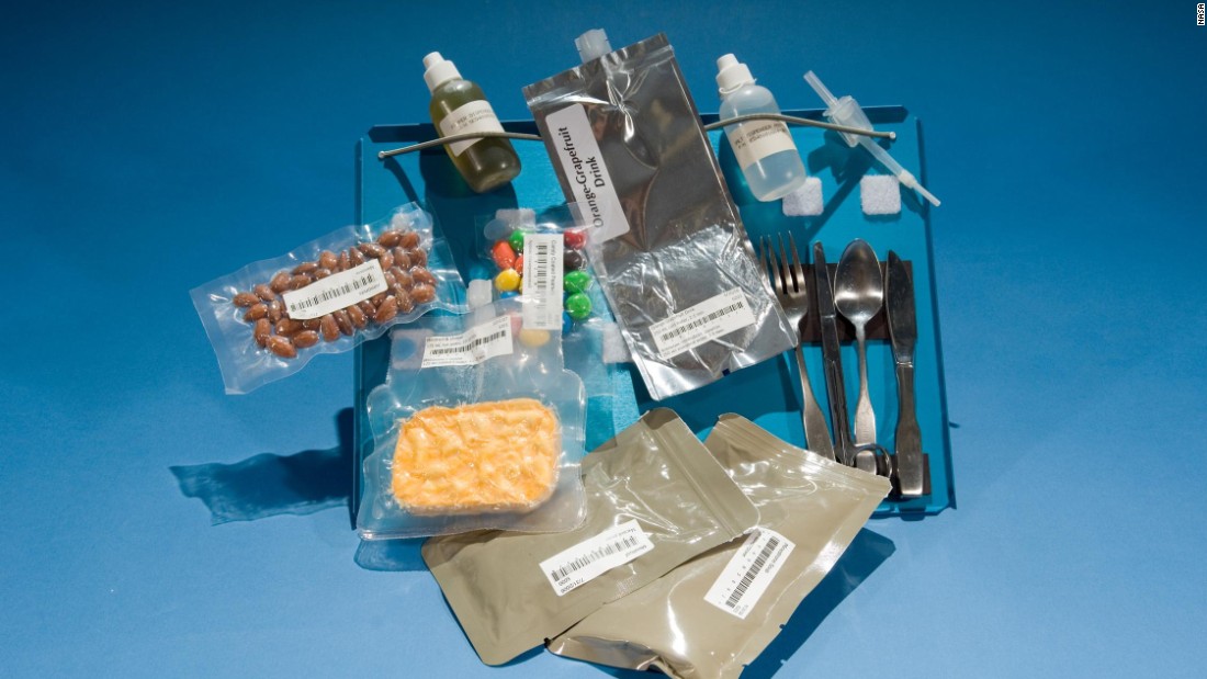 Rehydratables from the Space Shuttle missions (1981-1989), and the first appearance of M&amp;amp;Ms on the space food menu. Referred to simply as &quot;candy-coated chocolates&quot; by NASA, they are now a regular space snack. Note also the magnets securing the cutlery to the tray. 