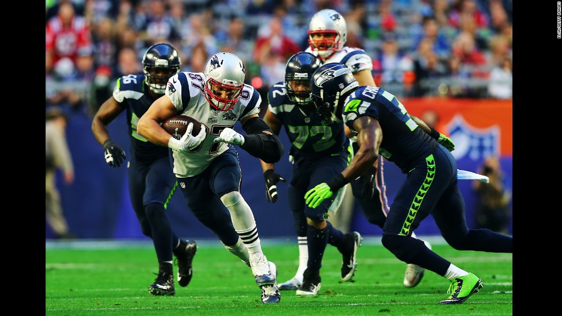 Gronkowski tries to evade Seattle defenders after a first-quarter catch.