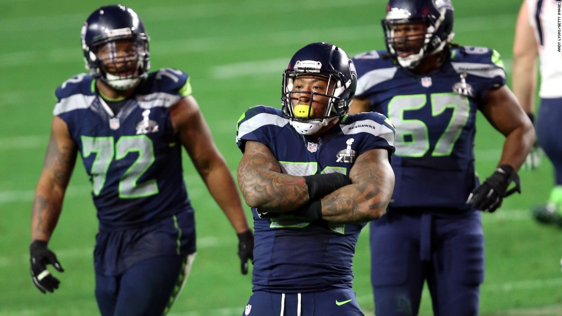 Seattle&#39;s Bruce Irvin, front, reacts after a sack on Brady.