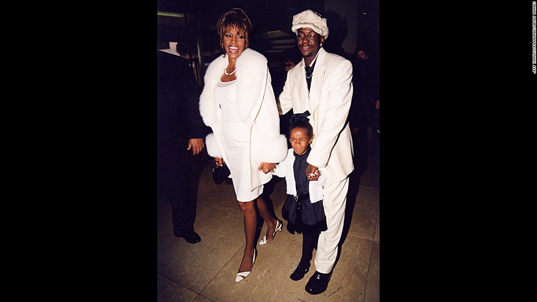 Bobbi Kristina was photographed with her famous parents often in the early years of their marriage. Here she is with them in the mid-&#39;90s.