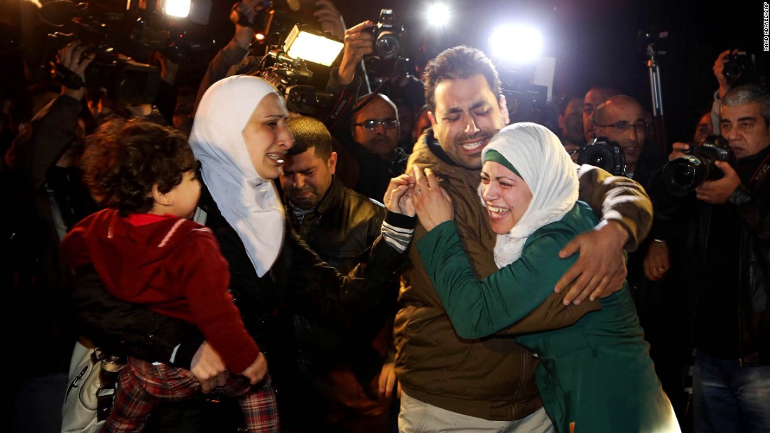 A man comforts al-Kasasbeh&#39;s wife during the protest in front of the royal palace on January 28.