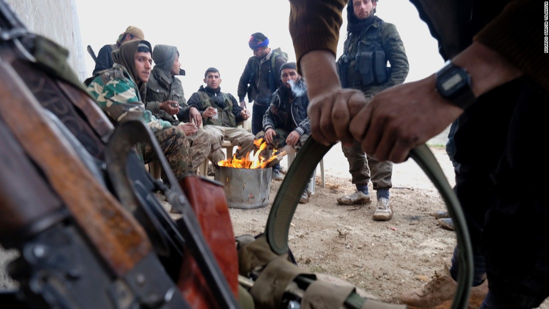 Members of the YPG prepare their ammunition on January 31.