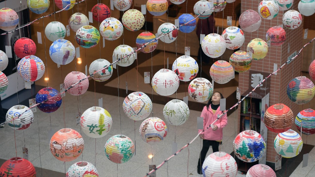 A girl admires painted lanterns during a festival in New Taipei City, Taiwan, on Saturday, January 31. 