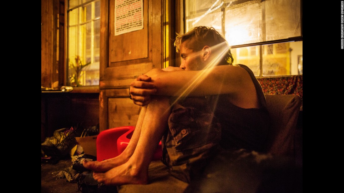 A squatter sits in the living room of a London squat called &quot;Borough High Street.&quot; Photographer Corinna Kern visited several squats in the capital city.