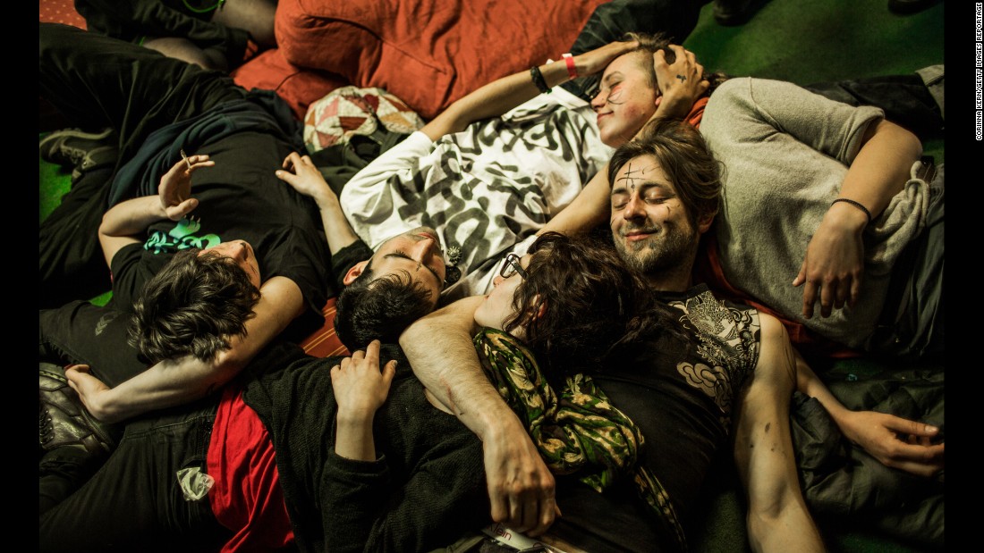 Residents lie together in the London squat called &quot;Borough High Street.&quot; The communal squatting lifestyle often creates strong bonds and a family feeling among the residents. 