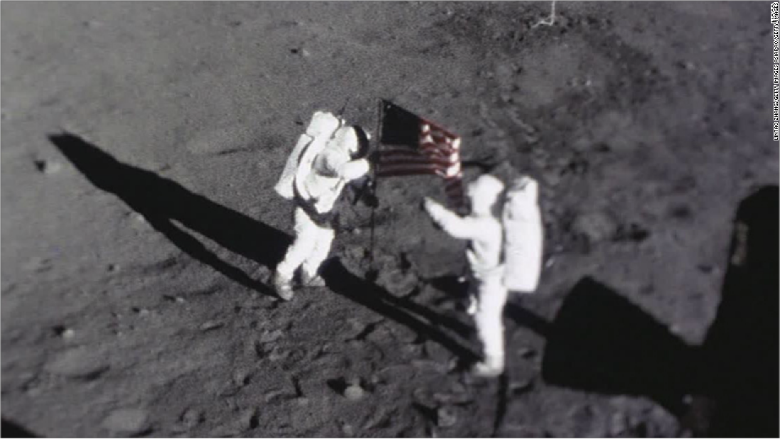 Astronauts Neil Armstrong and Buzz Aldrin place the American flag on the Moon. This image was captured by the Apollo 11 Data Acquisition Camera that was mounted to the lunar module Eagle.