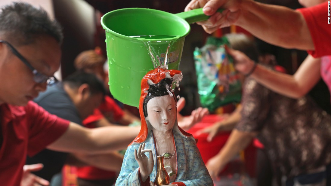 A Chinese god statue is cleaned at a temple in Jakarta, Indonesia, on February 12.