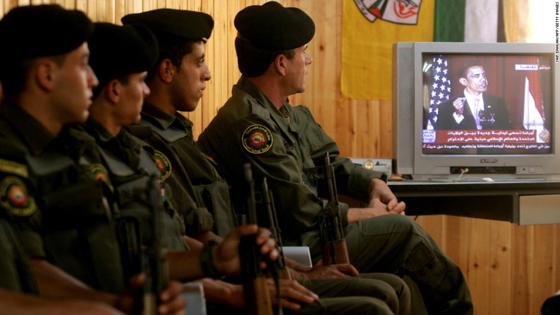 Palestinian security forces in Jenin, West Bank, listen to Obama speak from Cairo University in Egypt in June 2009. The Palestinian Authority hailed as a &quot;good beginning&quot; Obama&#39;s speech to the Muslim world in which he reiterated his support for a Palestinian state.