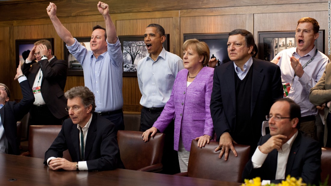 British Prime Minister David Cameron, Obama, German Chancellor Angela Merkel and others watch the overtime shootout of the Champions League final between Chelsea and Bayern Munich in a conference room at Camp David, Maryland, during a G-8 Summit in May 2012.