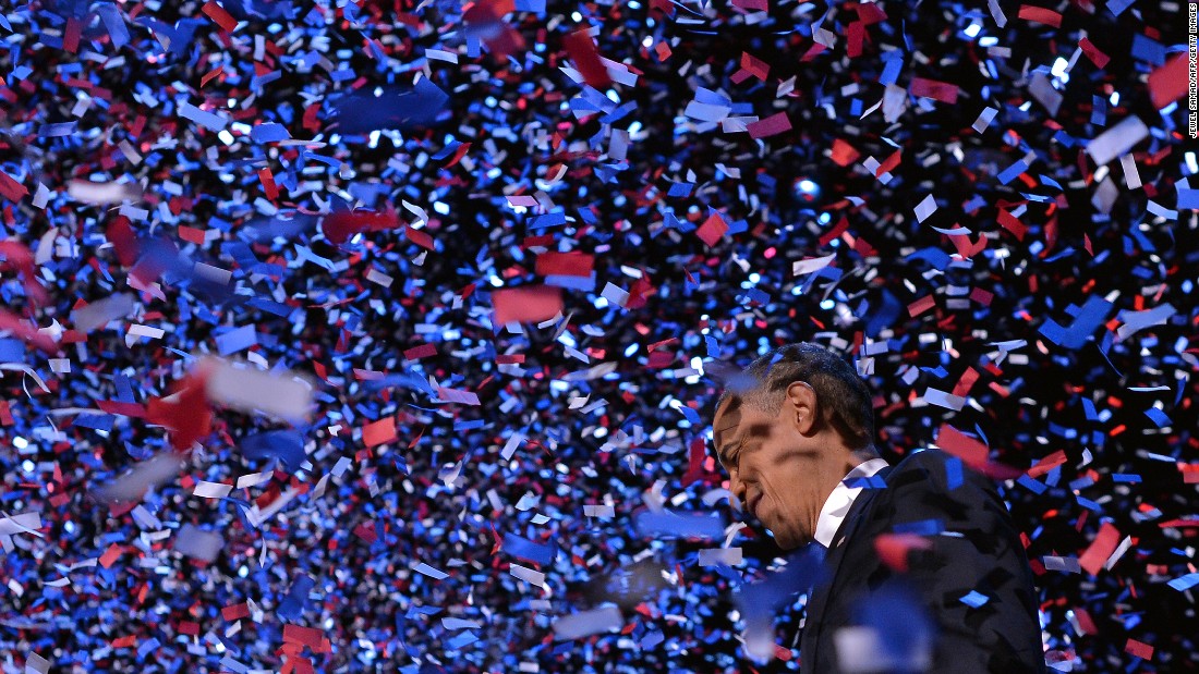 Obama celebrates on stage in Chicago after defeating Romney on Election Day in 2012.