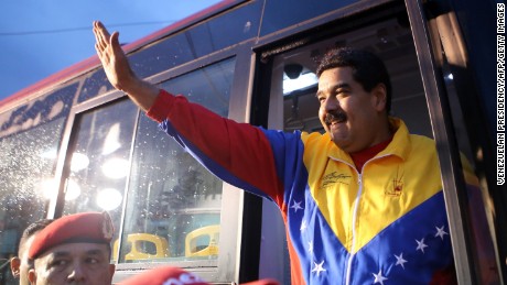 Handout photo released by the Venezuelan Presidency of Venezuelan President Nicolas Maduro waving to supporters during a TV program in Caracas on February 12, 2015. Venezuelan police fired tear gas Thursday to break up students demonstrating against President Nicolas Maduro's government, on the anniversary of protests that eventually left 43 people dead last year.