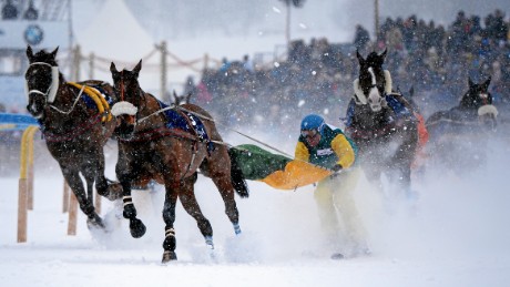 Franco Moro marginally leads the field in a skijoring race in St Moritz.