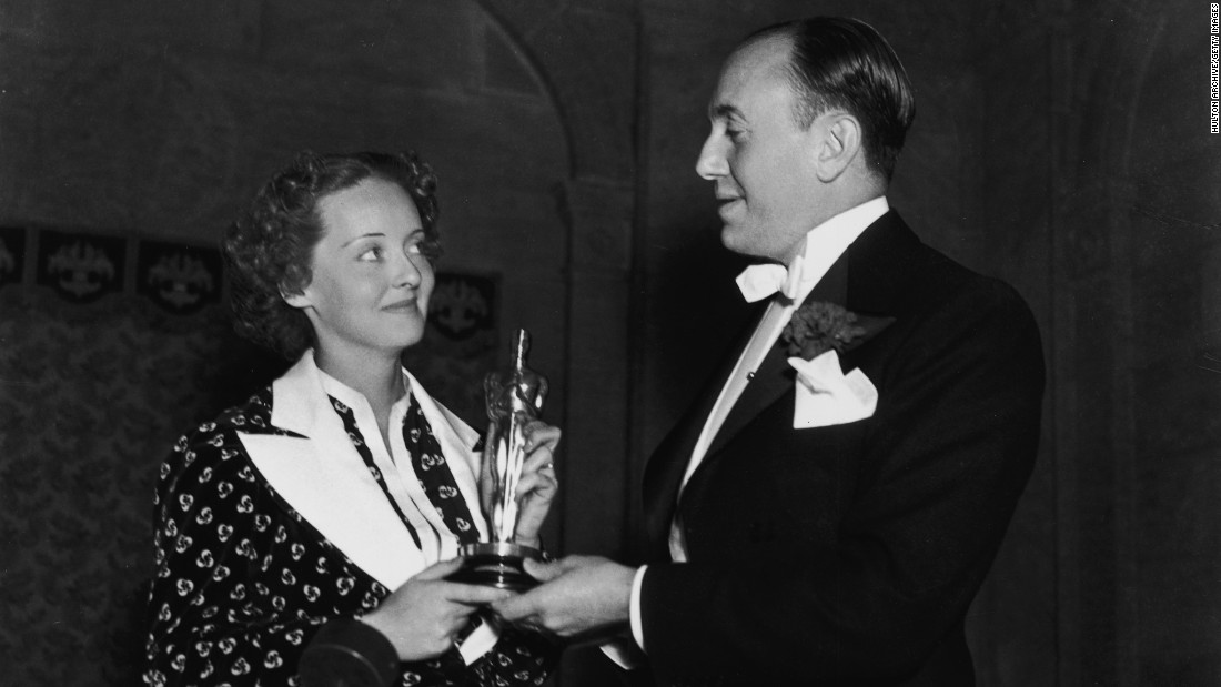 &lt;strong&gt;Bette Davis (1936):&lt;/strong&gt; Bette Davis and film producer Jack L. Warner hold Davis' best actress Oscar at the ceremony held in 1936. Davis won her first Oscar for her role in the film &quot;Dangerous.&quot;