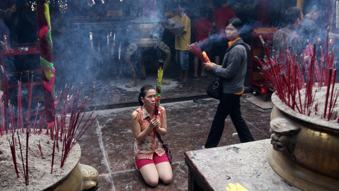 A woman prays at a temple in Jakarta, Indonesia, on February 18. 