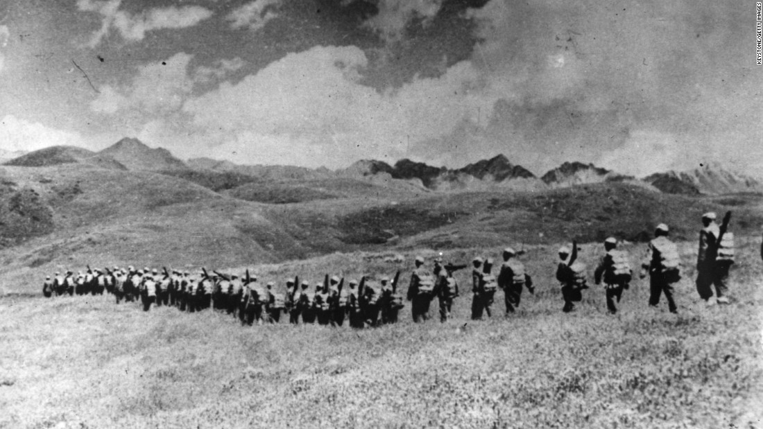 Chinese troops march over the highlands after their invasion of Tibet in 1950. At age 15, the Dalai Lama assumed full political power ahead of schedule. His investiture was moved up from his 18th birthday as a result of China&#39;s invasion.