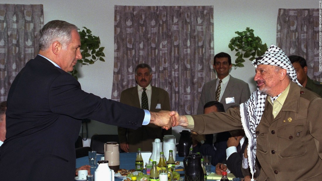 Netanyahu meets with Palestinian leader Yasser Arafat for the first time in September 1996. They met at an Israeli army base at the Erez Checkpoint in Gaza.