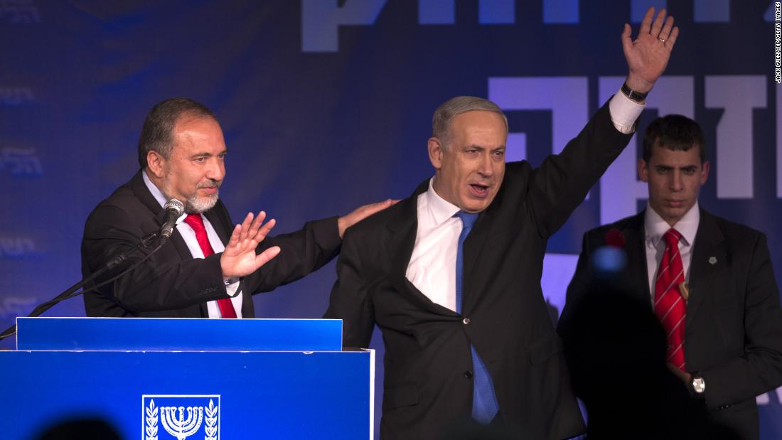 Netanyahu and Avigdor Lieberman of the Likud-Beiteinu coalition party greet supporters as they arrive on stage on election night in January 2013.