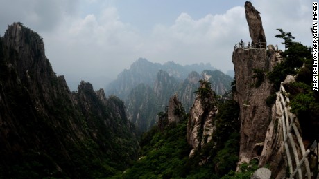 This photo taken on June 16, 2014 shows the &quot;Top of Peak&quot; formation at the Huangshan (Yellow Mountains) park in Anhui Province.  The UNESCO World Heritage Site is one of China&#39;s major tourist destinations and has been a source of inspiration to Chinese painters, writers and poets for thousands of years.      AFP PHOTO/Mark RALSTON        (Photo credit should read MARK RALSTON/AFP/Getty Images)
