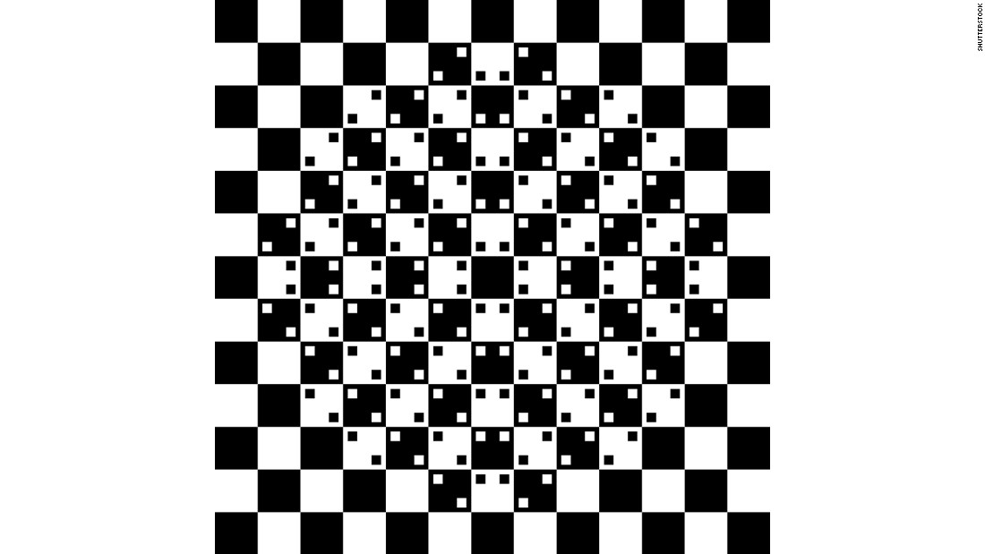 The center of this image, made only with squares, appears to bulge out, even though all of the lines are actually straight. 