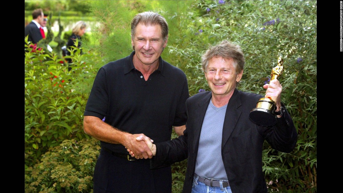 Polanski receives his 2003 Academy Award for best director for &quot;The Pianist&quot; from Harrison Ford in France.