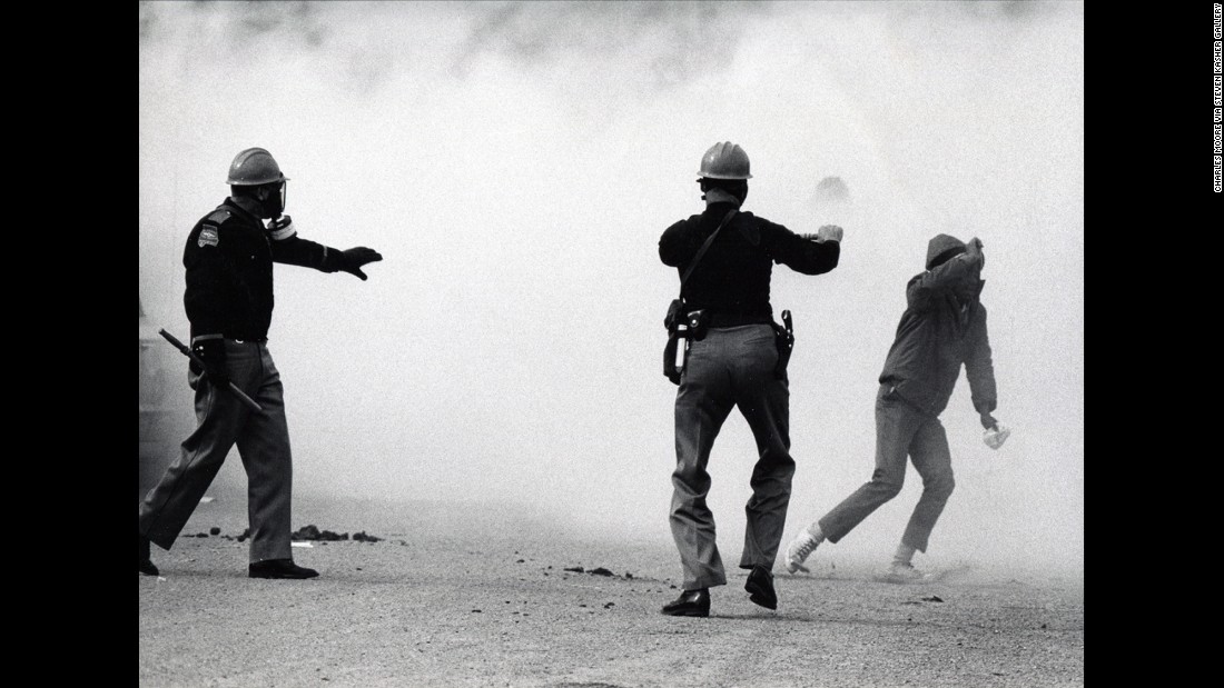 Alabama state troopers wear gas masks as tear gas is fired on marchers in 1965. Fifty years ago, about 600 people began a 50-mile march from Selma, Alabama, to the state capital of Montgomery so that they could protest discriminatory practices that prevented black people from voting. But as the marchers descended to the foot of the Edmund Pettus Bridge, state troopers used brutal force and tear gas to push them back. It is now known as &quot;Bloody Sunday.&quot;