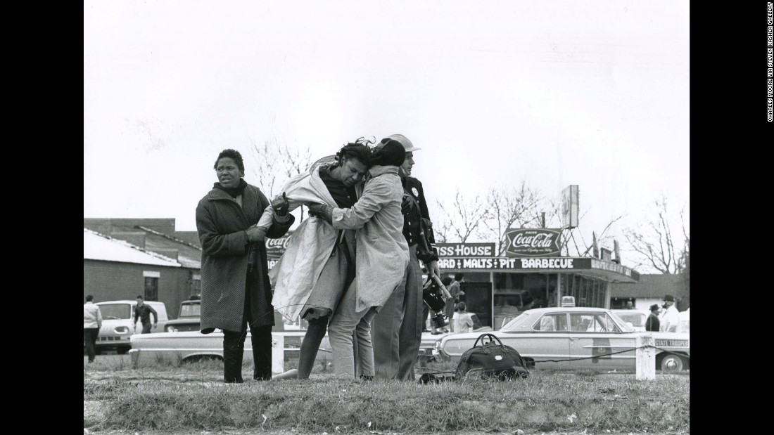 Activist Amelia Boynton is helped to her feet after being knocked unconscious by a state trooper. &quot;The quality, the depth, the sense of reality that (photographer Charlie Moore) brings to the work is unparalleled,&quot; said Steven Kasher, &lt;a href=&quot;http://www.stevenkasher.com/&quot; target=&quot;_blank&quot;&gt;whose gallery is showing the Selma images&lt;/a&gt; of Moore and other essential witnesses of the civil rights era.