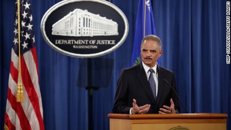 WASHINGTON, DC - MARCH 04: Attorney General Eric Holder delivers remarks about the Justice Department's findings related to two investigations in Ferguson, Missouri, at the Robert F. Kennedy Department of Justice Building March 4, 2015 in Washington, DC. Holder delivered the remarks for an audience of department employees who worked on the investigations after a white police officer shot and killed an unarmed black teenager, sparking weeks of demonstrations and violent clashes. 