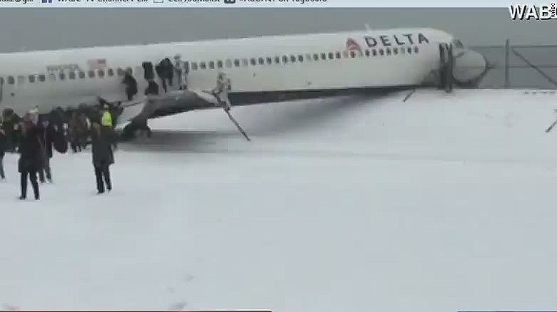 Plane skids off runway at LGA - CNN Video