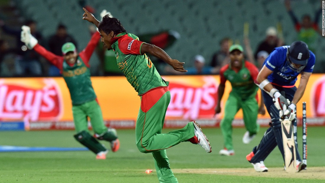 Bangladesh bowler Rubel Hossain celebrates dismissing England&#39;s last batsman, James Anderson, to seal a famous victory that saw his side through to the quarterfinals of the cricket World Cup. Defeat confirmed England&#39;s exit before the group stage has even finished.