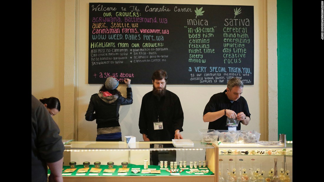 Employees make last-minute preparations before the grand opening of the Cannabis Corner in North Bonneville, Washington, on March 7, 2015. The pot shop is the first city-owned recreational marijuana store in the country.