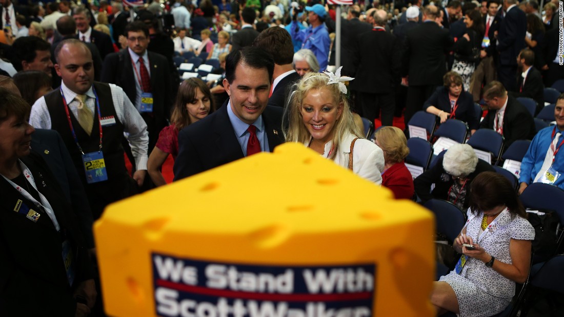 Walker poses with a woman during the Republican National Convention at the Tampa Bay Times Forum on August 28, 2012, in Tampa, Florida. 